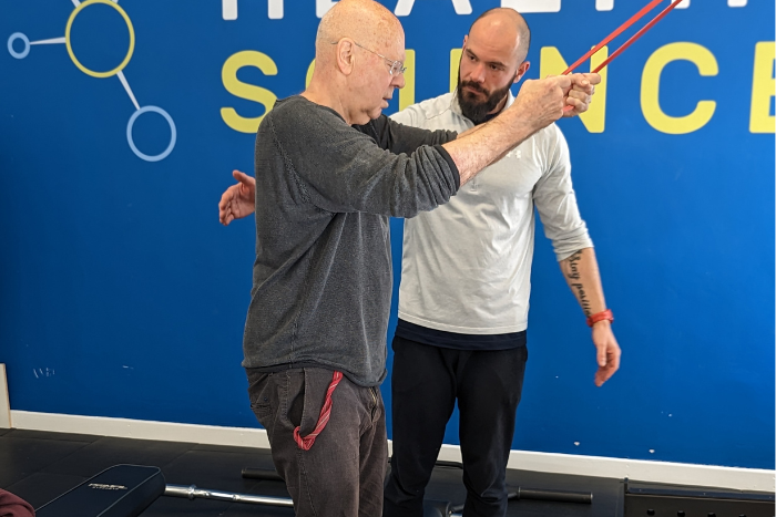 personal trainer Kubo working with stroke survivor personal trainer Kubo working with stroke survivor