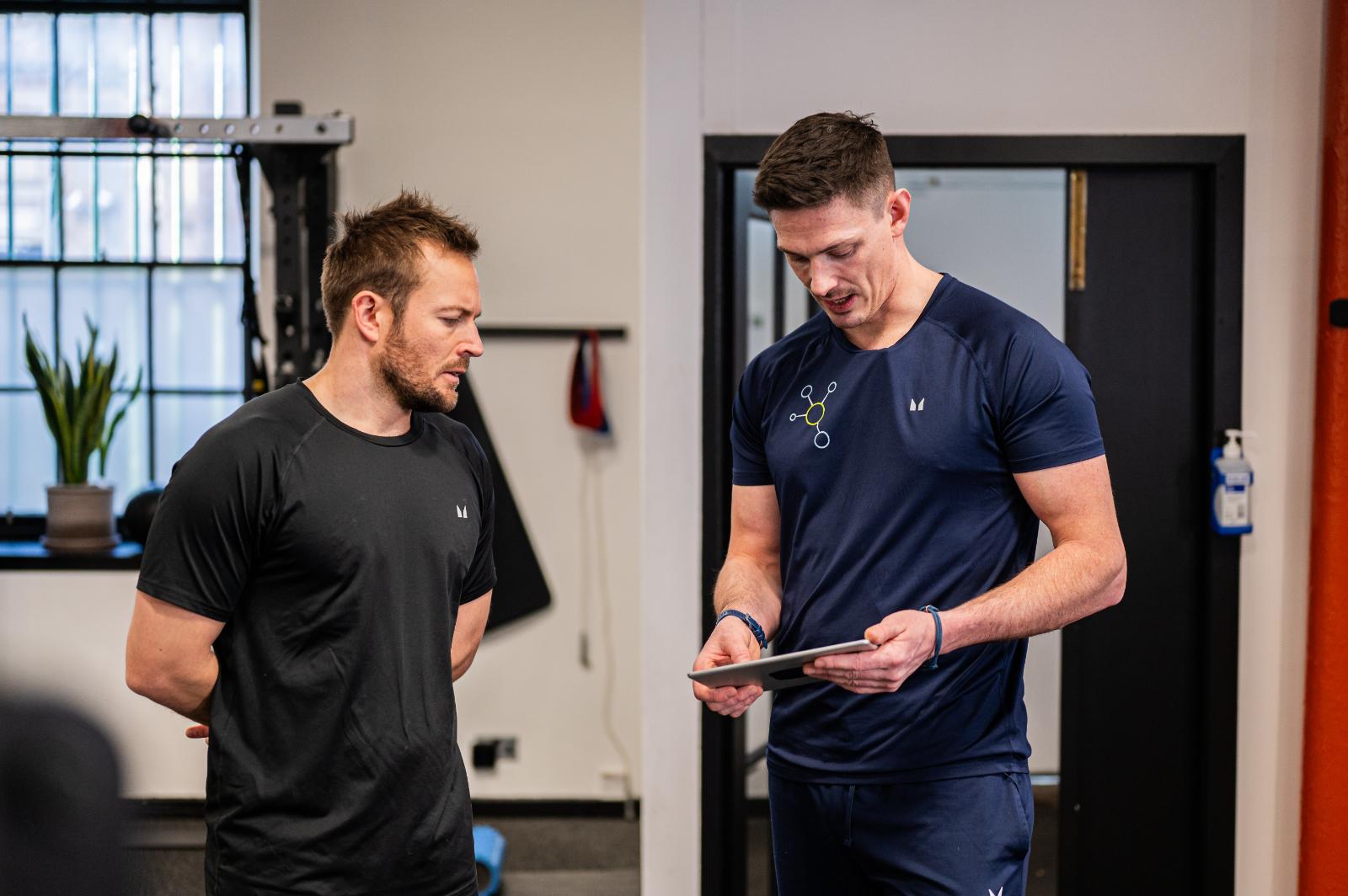 Health by Science practitioners reviewing digital biometrics for personal training Edinburgh programs in Leith.