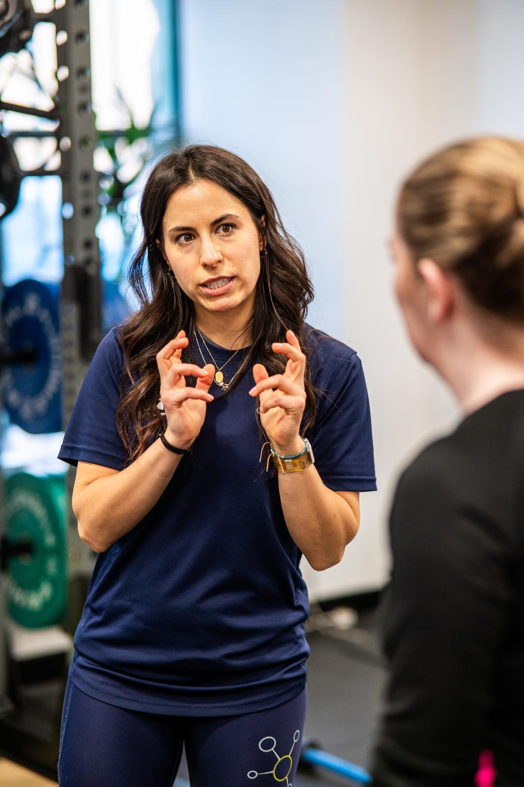 Detailed clinical instruction during a rehabilitation-focused personal training Edinburgh session at our specialised lab.