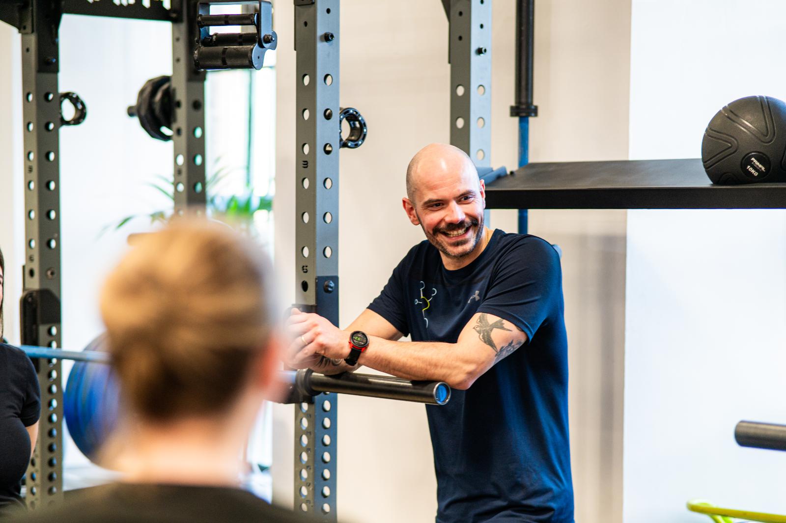 Health by Science team member discussing evidence-based rehabilitation goals at our clinical facility in Leith.