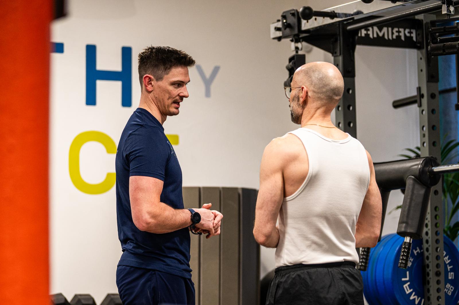 Clinical discussion of rehabilitation goals and performance data between a specialist and client at Health by Science Leith.