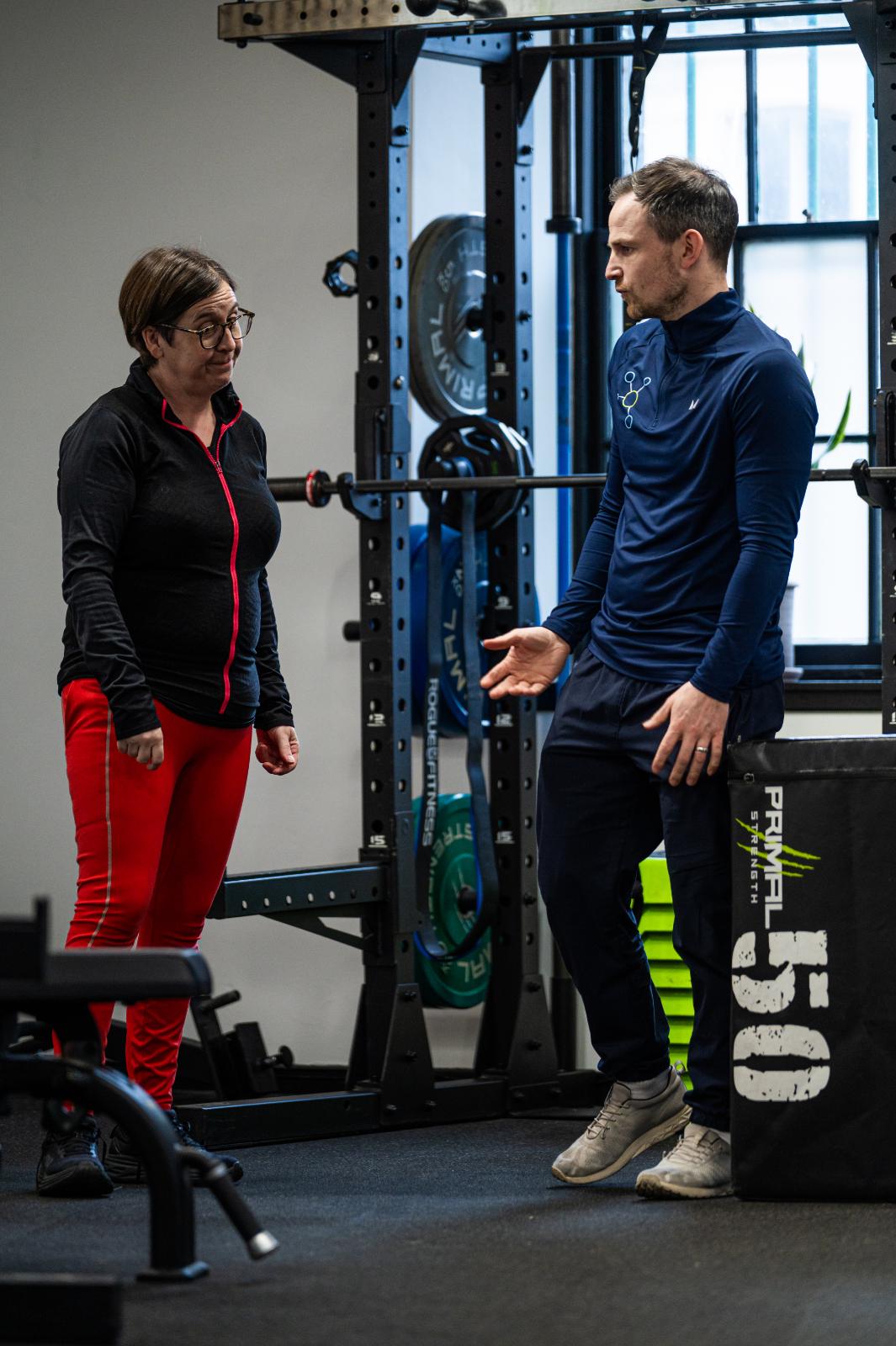 Professional coaching discussion regarding clinical exercise progressions for personal training Edinburgh at the specialized Leith facility.