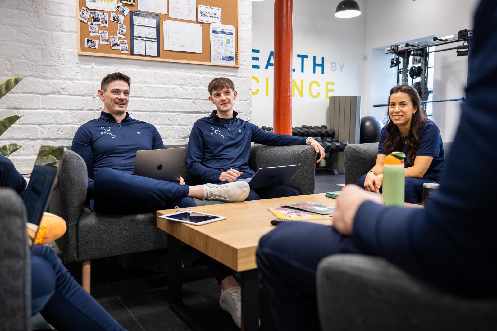 Multidisciplinary team of Health by Science experts collaborating on complex patient case studies at our Leith clinic.