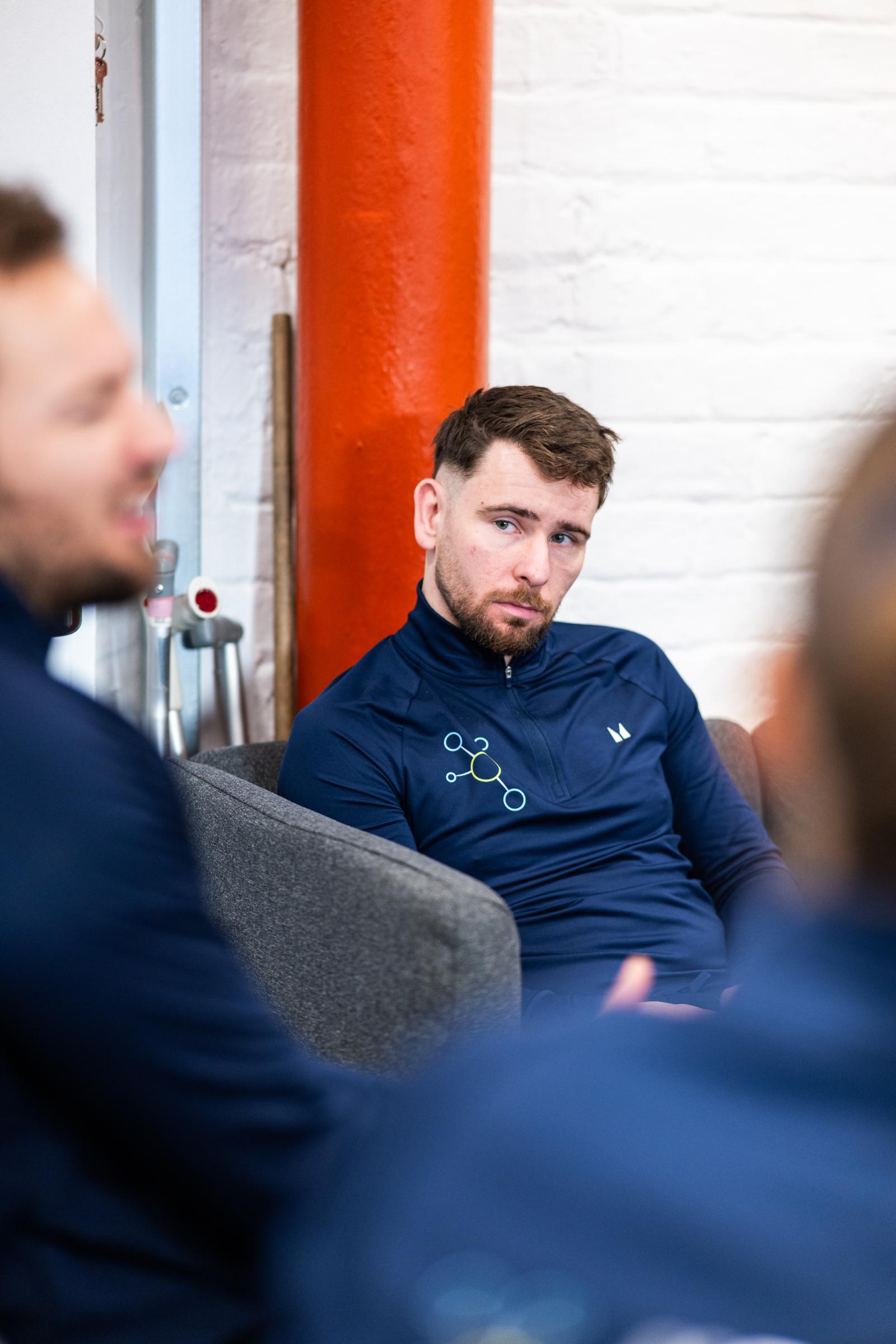 Focused clinical discussion between specialists regarding evidence-based personal training protocols in our Leith lab.