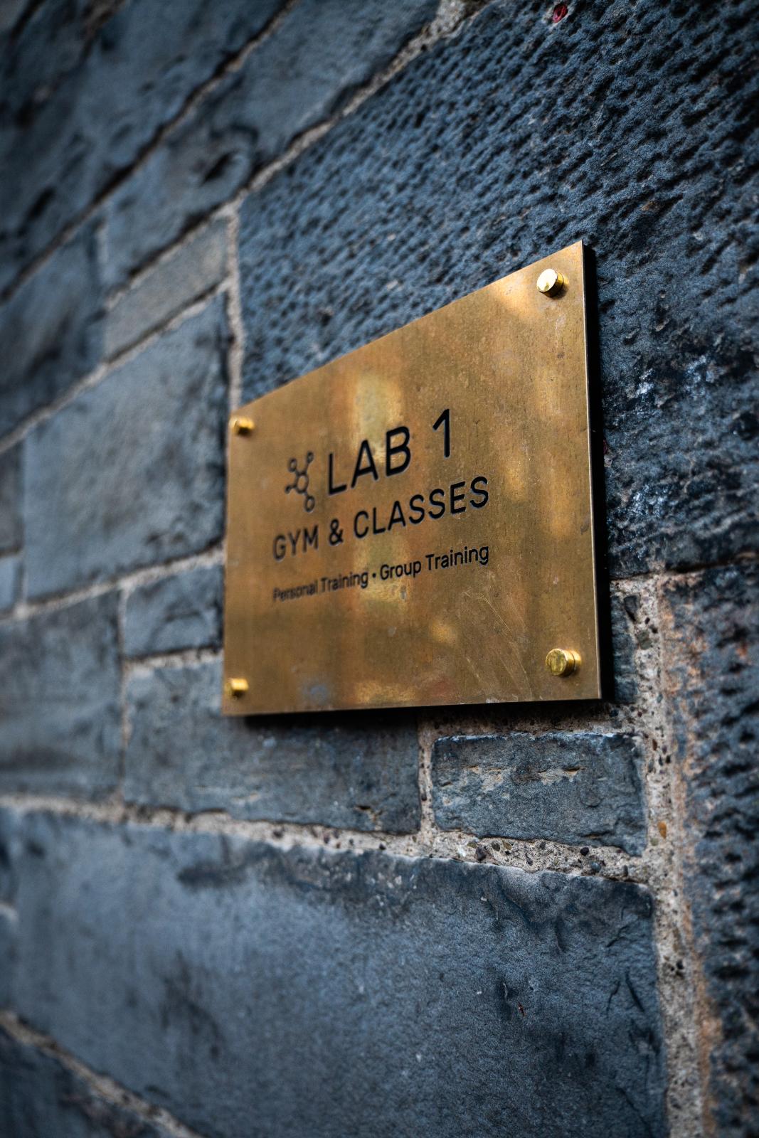 Professional brass signage for Health by Science Lab 1, specialising in clinical gym classes and personal training Edinburgh.