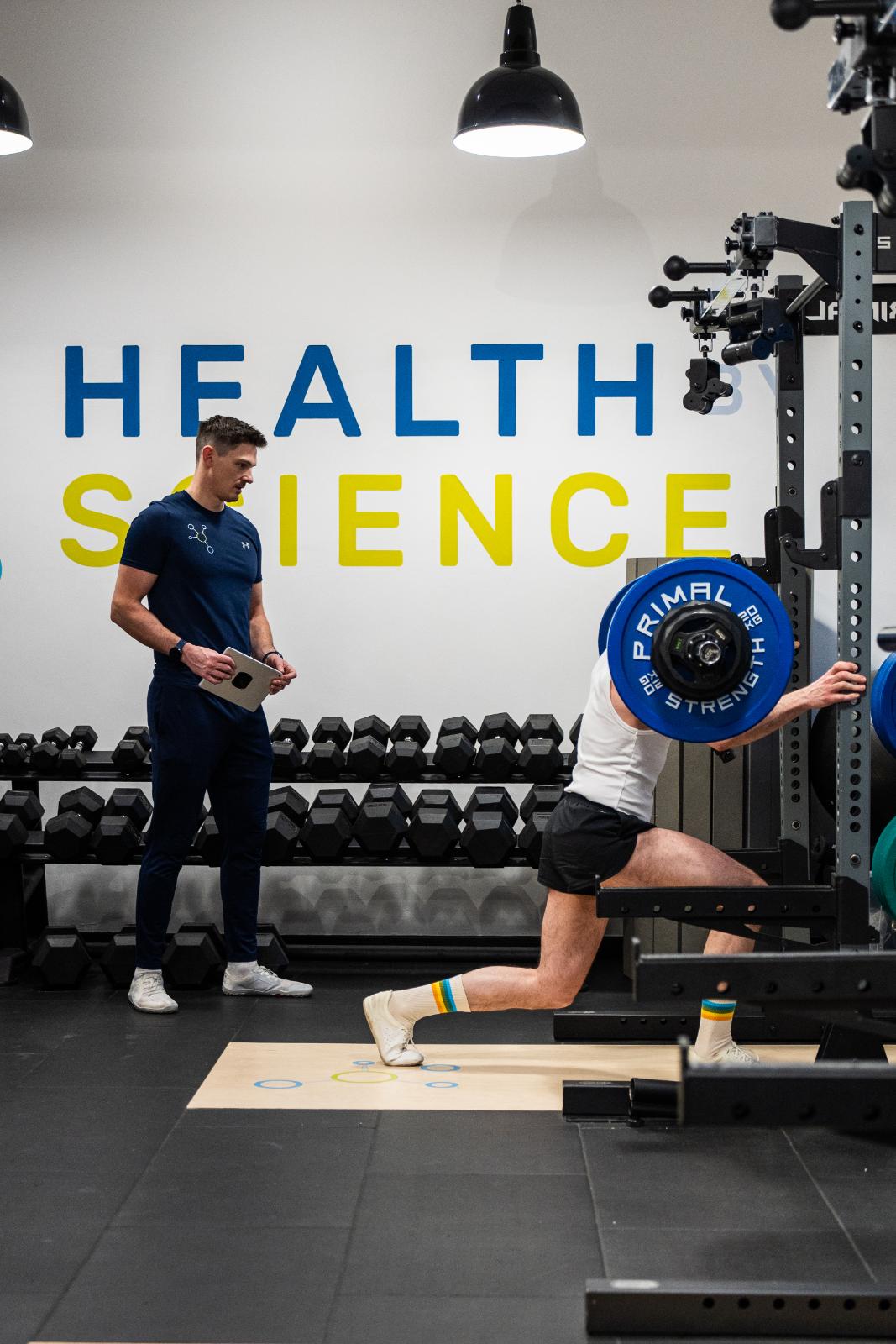 Clinical assessment of a weighted lunge pattern conducted by a specialist at the Health by Science gym in Leith.