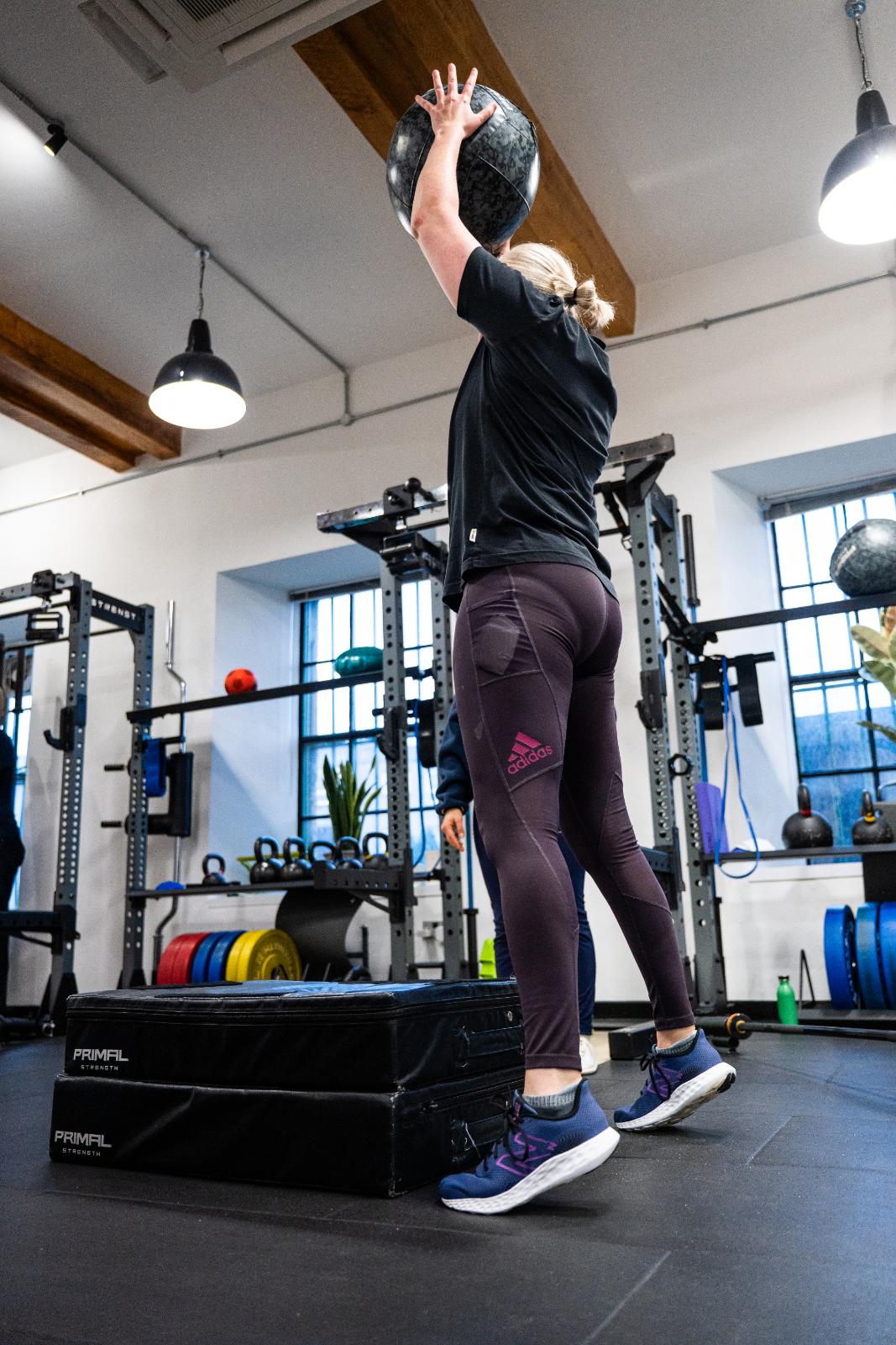 Clinical supervision of a medicine ball overhead press to assess functional explosive power and shoulder stability in Leith.