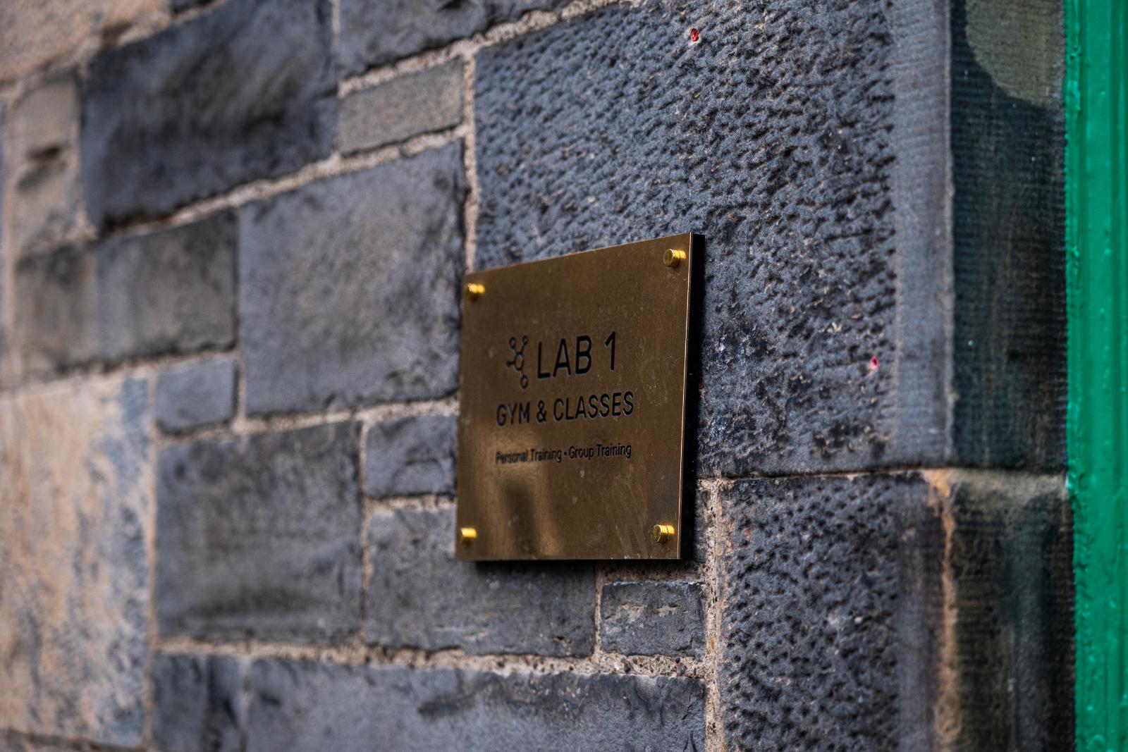 Detailed view of the Lab 1 professional signage at Health by Science, specialising in evidence-based personal training Edinburgh.