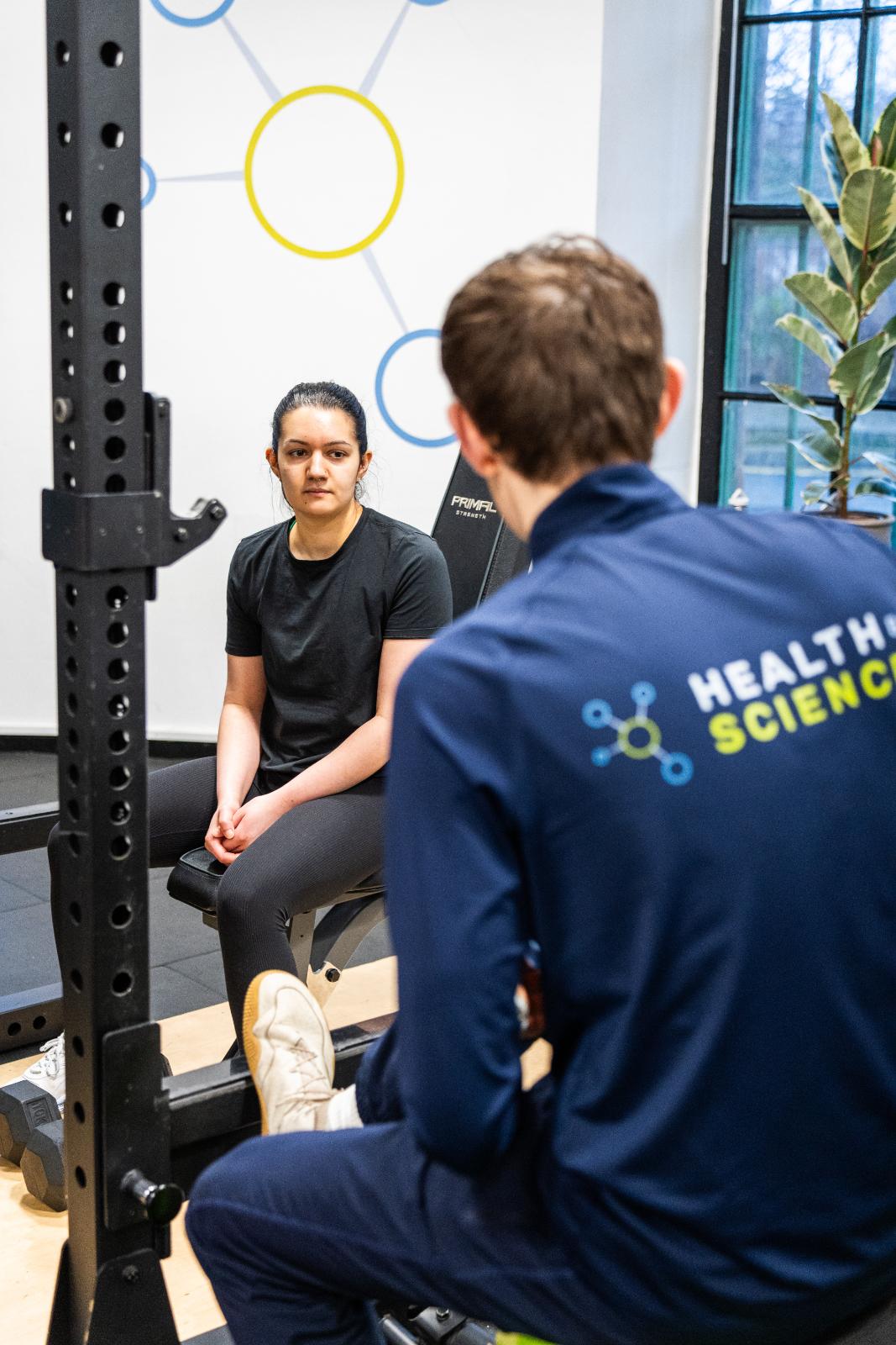 Health by Science specialist conducting a clinical movement consultation with a patient in our specialised Leith rehabilitation gym.