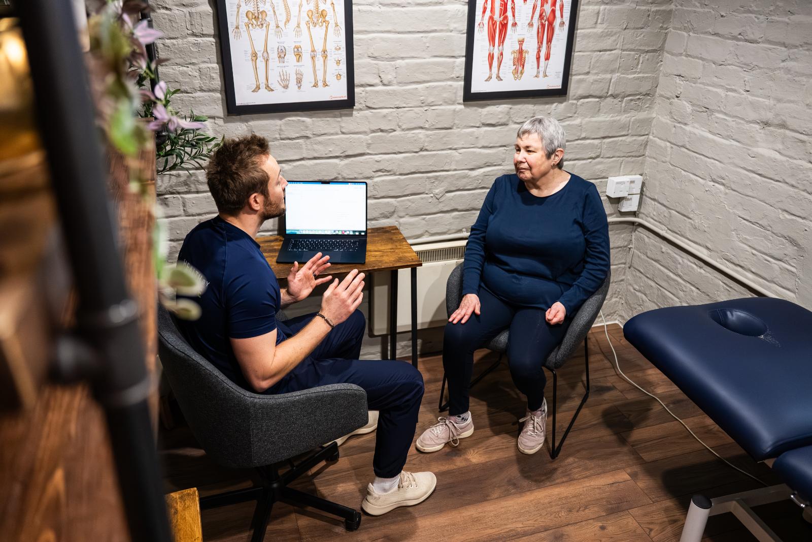 Specialist providing expert advice during a private consultation session to support evidence-based personal training Edinburgh goals.