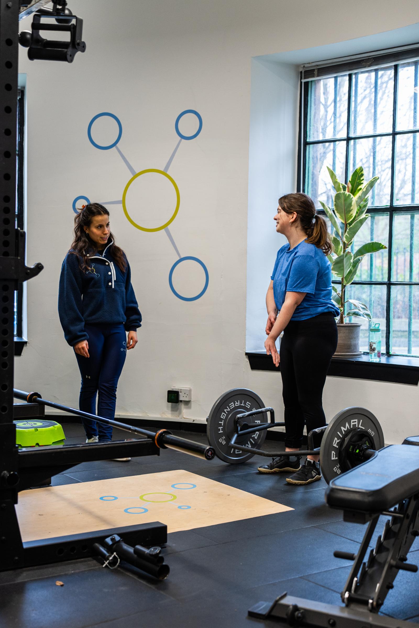 Collaborative movement review between a coach and client following a data-driven personal training Edinburgh session in Leith.