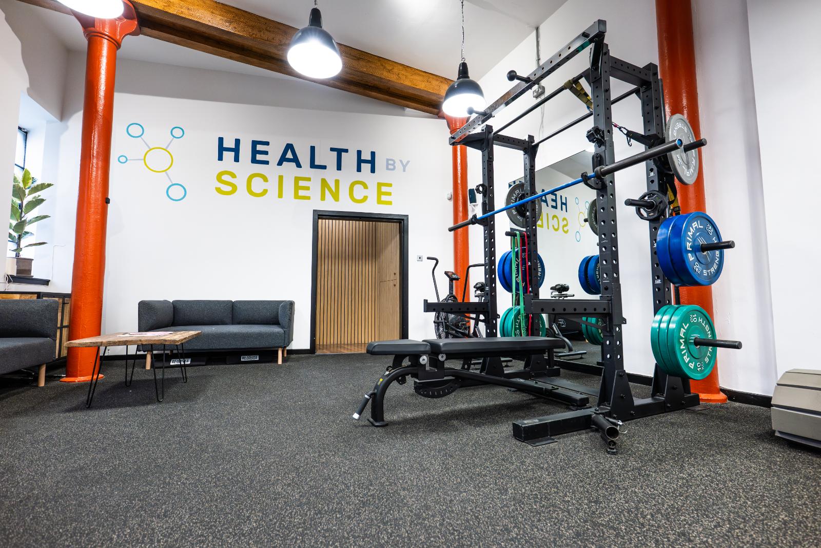 KA3_4566 A wide-angle view of the modern Health By Science gym facility in Edinburgh, featuring power racks and turf.