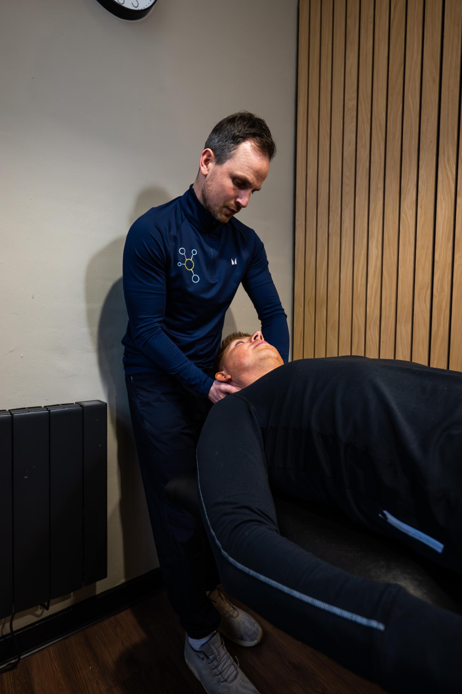 Health by Science specialist performing a clinical manual therapy assessment of a patient's neck and cervical spine in Leith.
