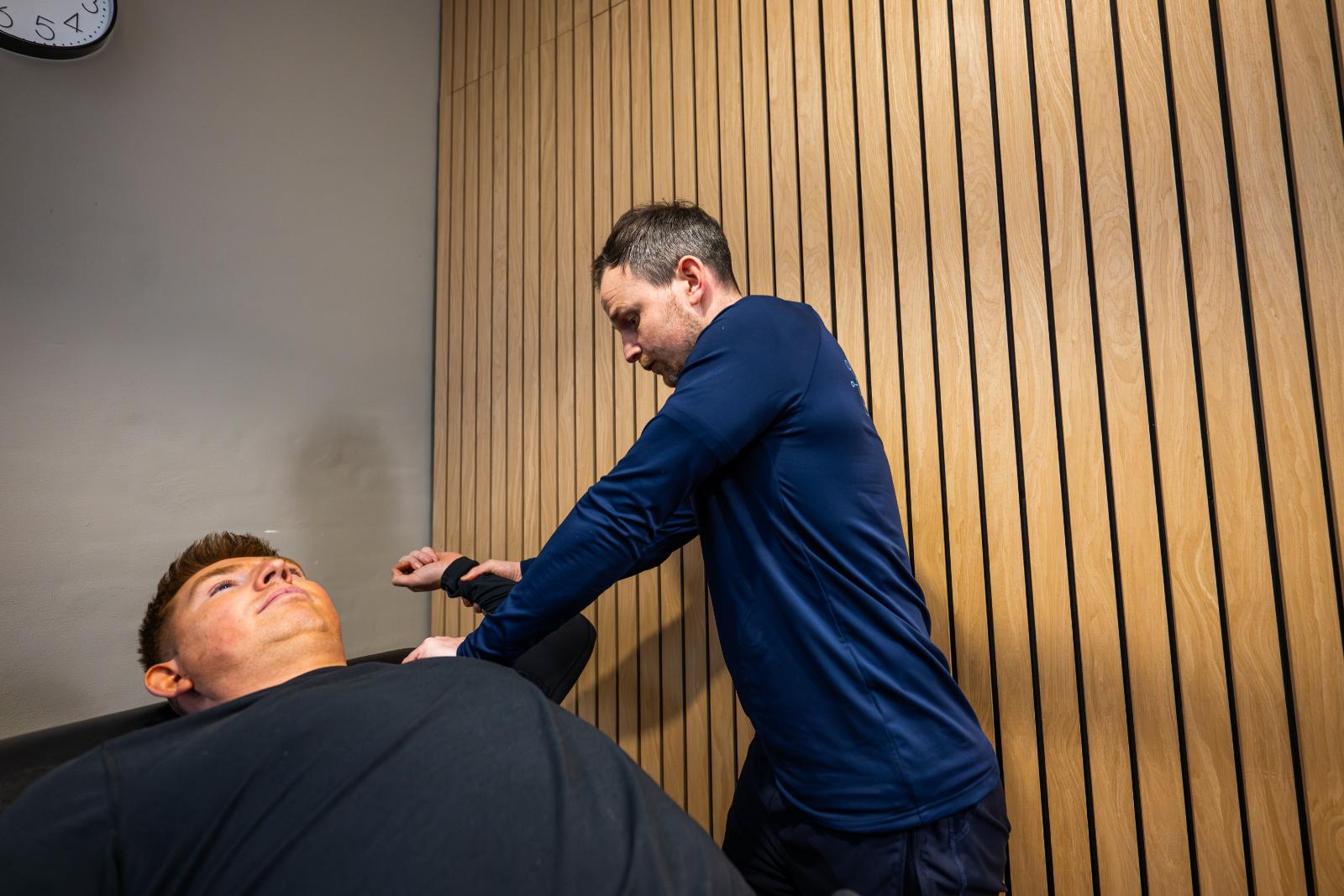 Clinical assessment of shoulder range of motion and joint stability conducted by a professional Health by Science specialist.